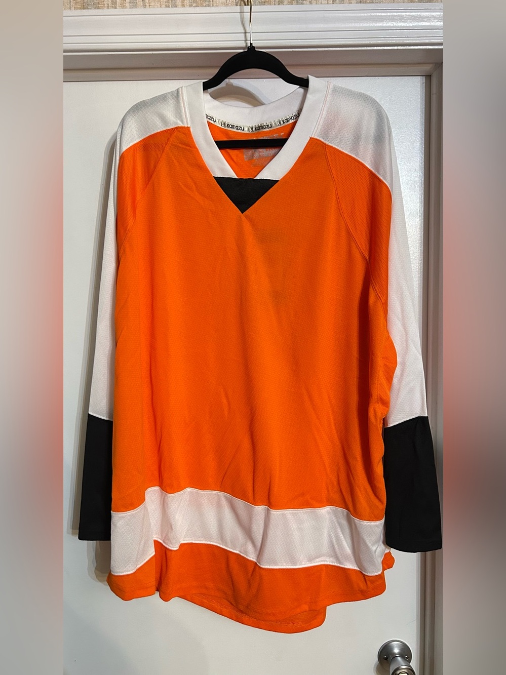 Orange and White Hockey Jersey with Black Accents